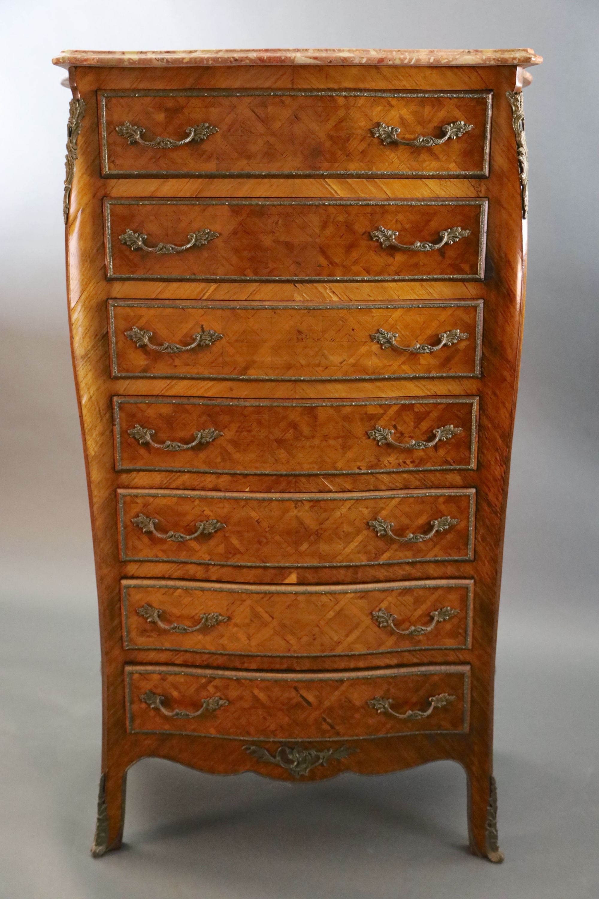 An early 20th century French Louis XVI style parquetry semanier,